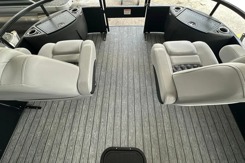 Slide: The Image of Interior of 2026 Ranger Reata 223FC boat with gray seating and flooring. - 13