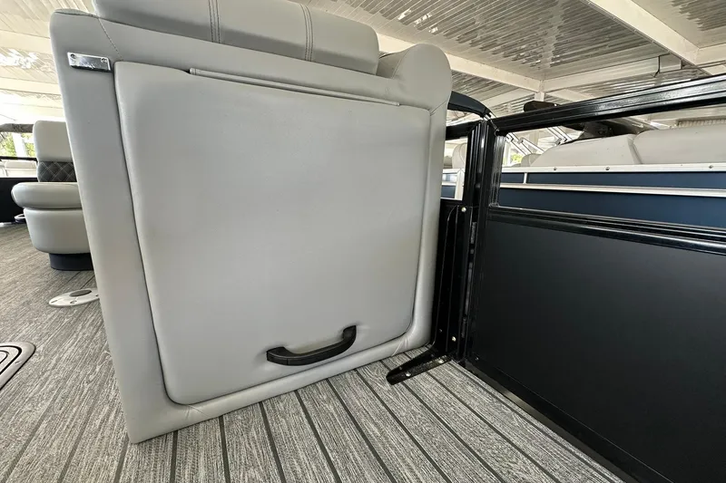 Slide: The Image of 2026 Ranger Reata 223FC interior with gray seating and modern design elements. - 15