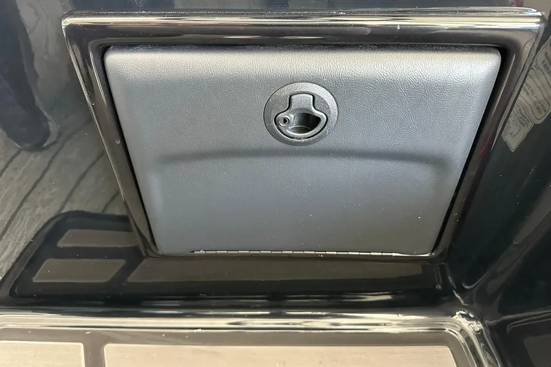 Slide: The Image of 2026 Ranger Reata 223FC storage compartment with secure latch. - 22