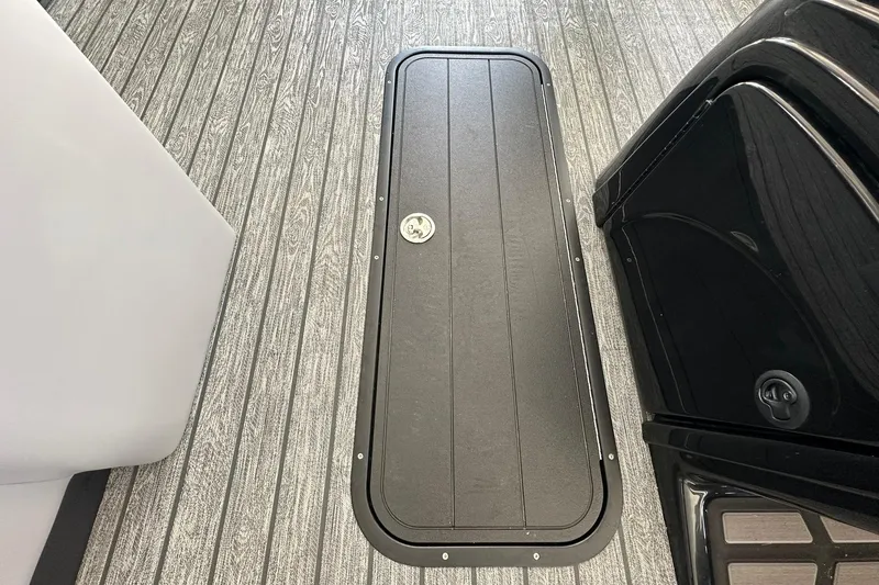 Slide: The Image of 2026 Ranger Reata 223FC boat interior with sleek flooring and storage compartment. - 24