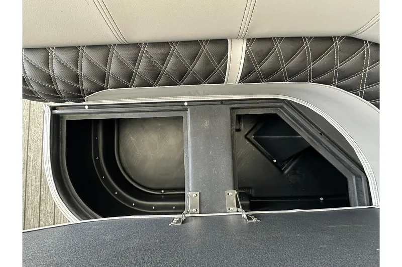 Slide: The Image of 2026 Ranger Reata 223FC boat storage compartment with quilted upholstery detail. - 26