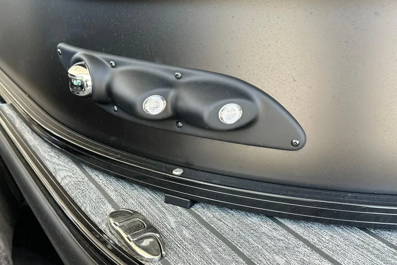 Slide: The Image of 2026 Ranger Reata 223FC boat detail with sleek black exterior and modern lighting. - 3