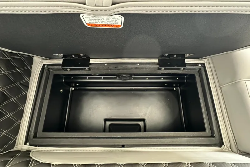 Slide: The Image of Open storage compartment in 2026 Ranger Reata 223FC boat with quilted upholstery. - 30