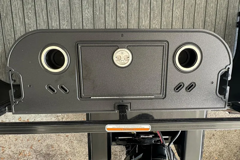 Slide: The Image of 2026 Ranger Reata 223FC boat dashboard with speaker mounts and control panel. - 33