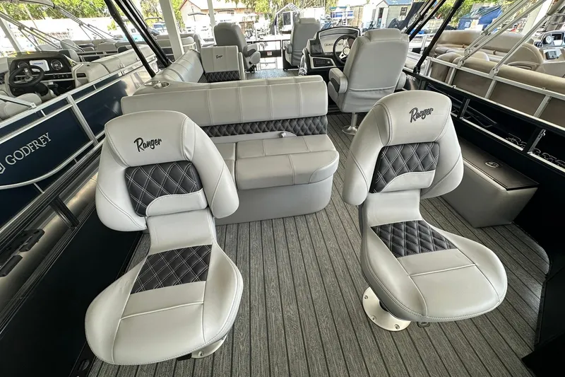 Slide: The Image of 2026 Ranger Reata 223FC boat interior with luxurious seating and modern design. - 34