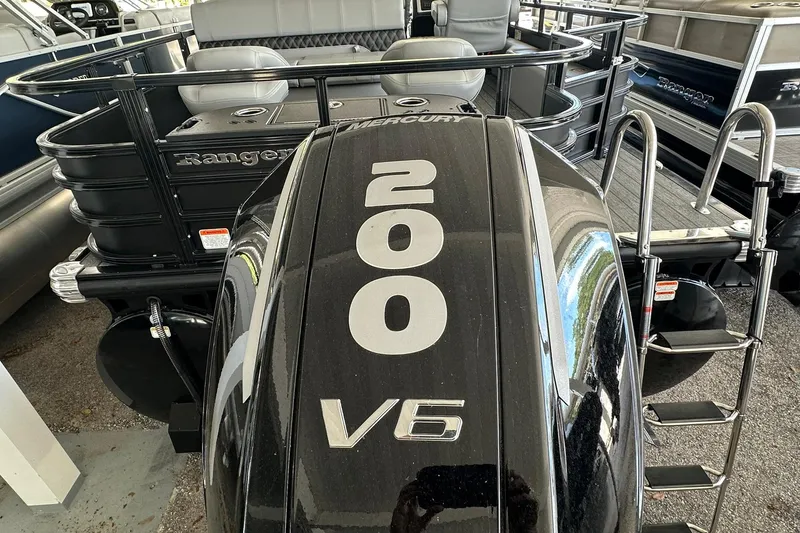 Slide: The Image of 2026 Ranger Reata 223FC boat with Mercury 200 V6 engine, rear view. - 36