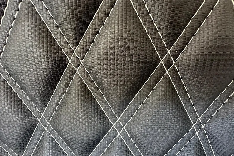 Slide: The Image of Quilted black leather texture from 2026 Ranger Reata 223FC interior. - 39