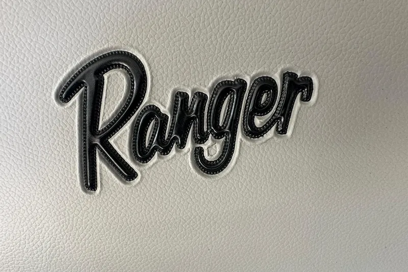 Slide: The Image of Ranger logo on 2026 Reata 223FC boat interior, textured white background. - 40