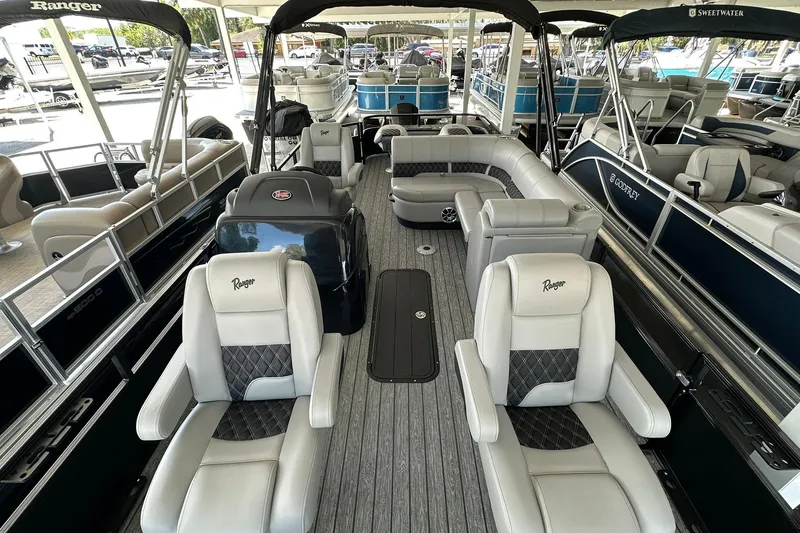 Slide: The Image of 2026 Ranger Reata 223FC pontoon boat with luxurious seating and modern design. - 6
