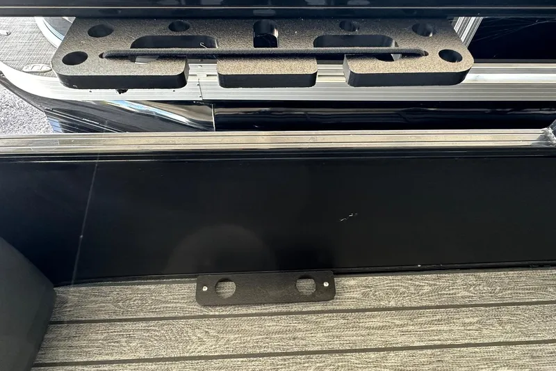 Slide: The Image of 2026 Ranger Reata 223FC boat interior with black panel and textured flooring. - 8