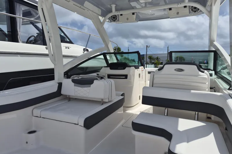 Slide: The Image of 2026 Robalo R277 Dual Console boat interior with white seating and modern design. - 15