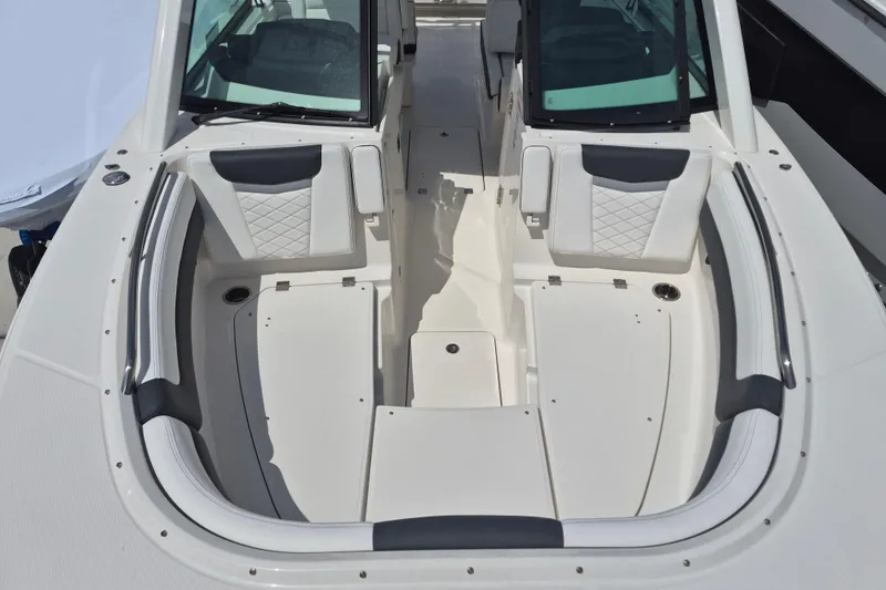 Slide: The Image of 2026 Robalo R277 Dual Console boat interior with cushioned seating and sleek design. - 3