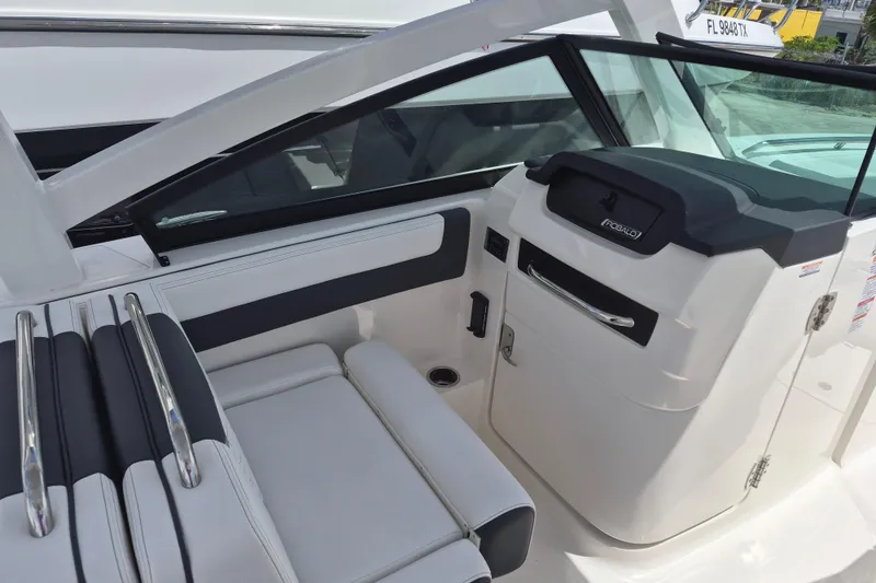 Slide: The Image of 2026 Robalo R277 Dual Console interior with sleek seating and modern dashboard design. - 9