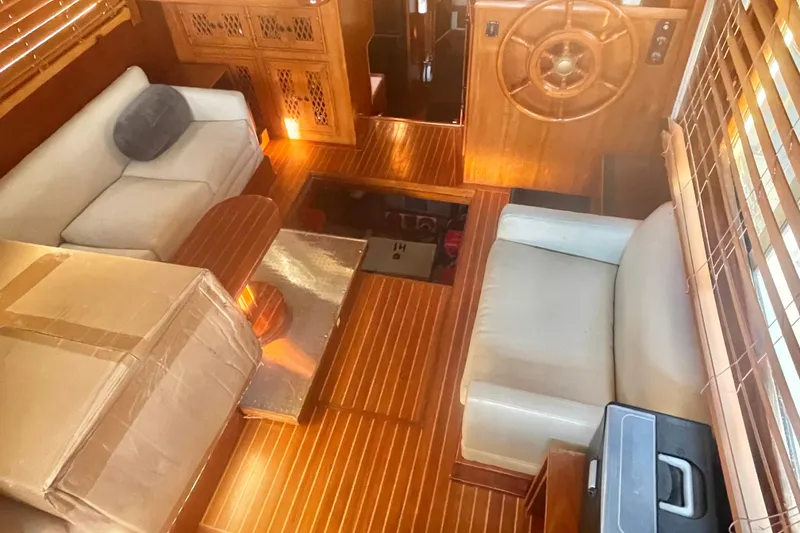 Slide: The Image of 1986 Tung Hwa aft cabin interior with wooden flooring and cozy seating area. - 14