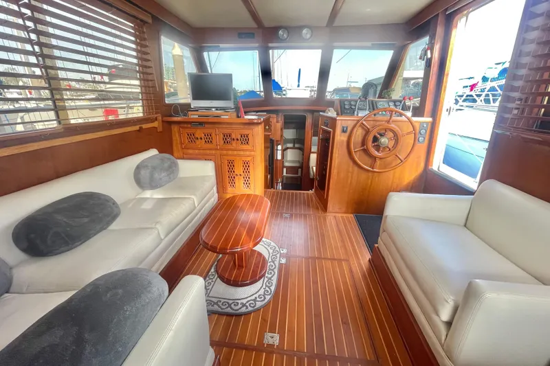 Slide: The Image of Luxurious 1986 Tung Hwa aft cabin interior with wooden accents and plush seating. - 18
