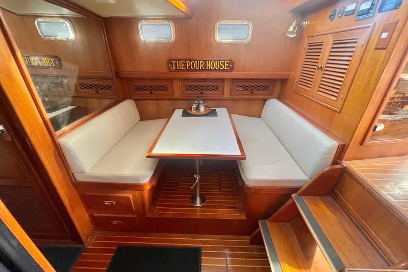 Slide: The Image of 1986 Tung Hwa aft cabin interior with wooden finish and cozy seating area. - 22
