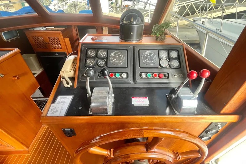Slide: The Image of 1986 Tung Hwa aft cabin boat helm with wooden wheel and control panel. - 28
