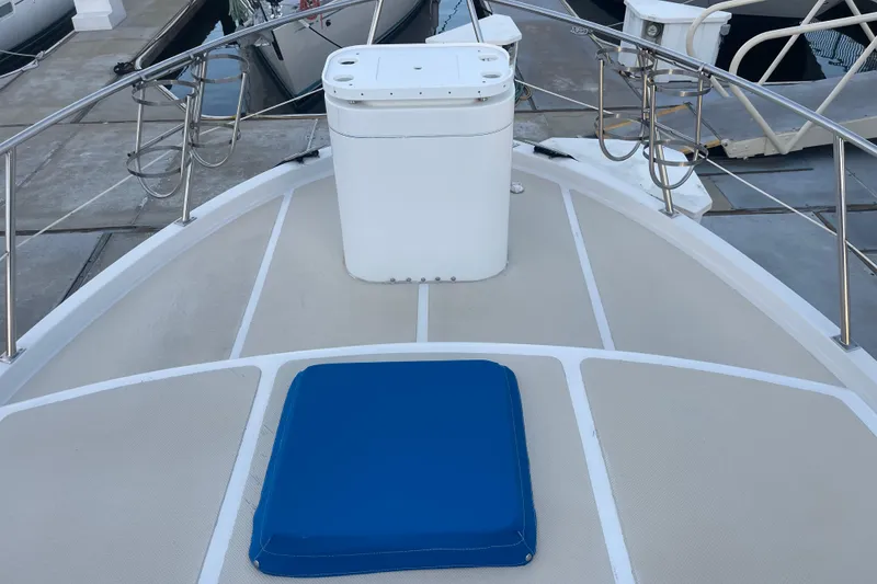 Slide: The Image of 1986 Tung Hwa aft cabin boat deck with blue cushion and railing. - 3