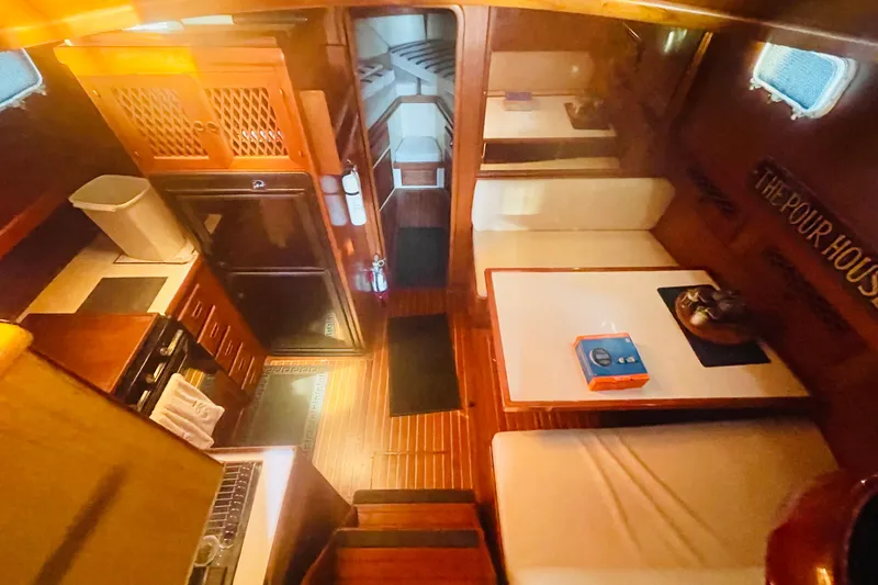 Slide: The Image of 1986 Tung Hwa aft cabin interior with wood finishes and cozy seating area. - 32