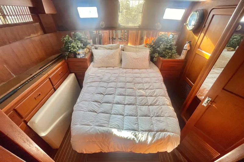 Slide: The Image of Cozy 1986 Tung Hwa aft cabin with bed, wooden interior, and natural light. - 33