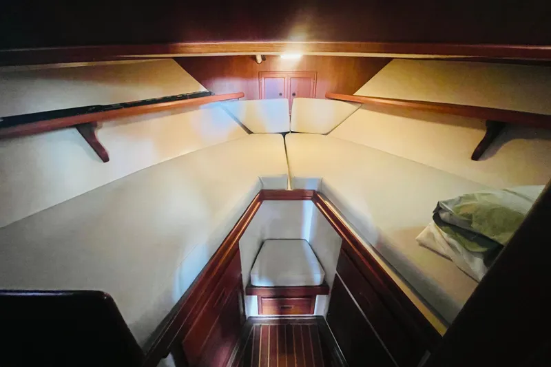 Slide: The Image of 1986 Tung Hwa aft cabin interior with cozy bedding and wooden accents. - 38