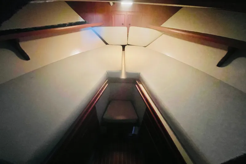 Slide: The Image of 1986 Tung Hwa aft cabin interior with cushioned seating and wooden accents. - 39