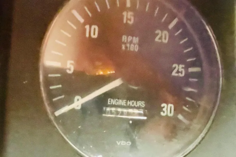 Slide: The Image of Close-up of a 1986 Tung Hwa aft cabin tachometer showing RPM and engine hours. - 45