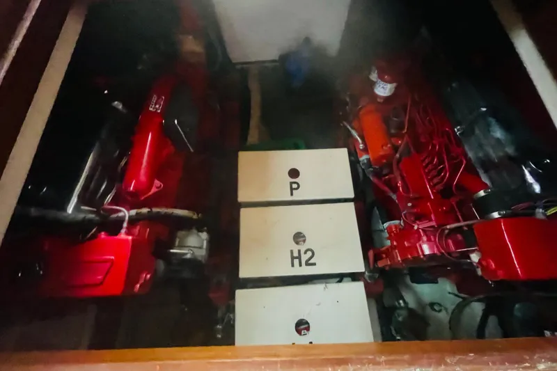 Slide: The Image of Engine room of a 1986 Tung Hwa aft cabin boat, featuring red machinery components. - 50