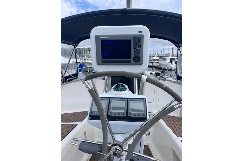 Slide: The Image of Steering wheel and navigation equipment on a 2006 Hunter 38 sailboat. - 5