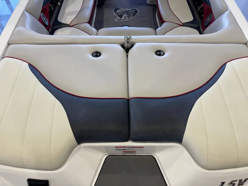 Slide: The Image of Interior of a 2012 Malibu Wakesetter 23 LSV with beige and black seating. - 10