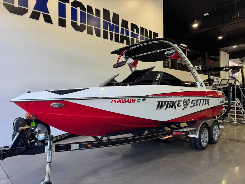 Slide: The Image of 2012 Malibu Wakesetter 23 LSV boat in showroom. - 2