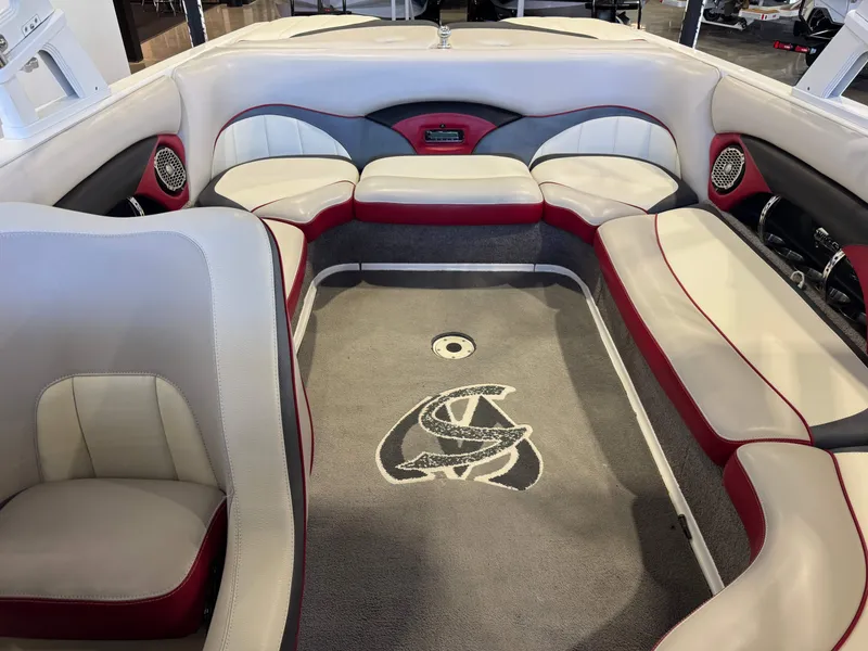 Slide: The Image of Interior of a 2012 Malibu Wakesetter 23 LSV with red and white seating. - 22