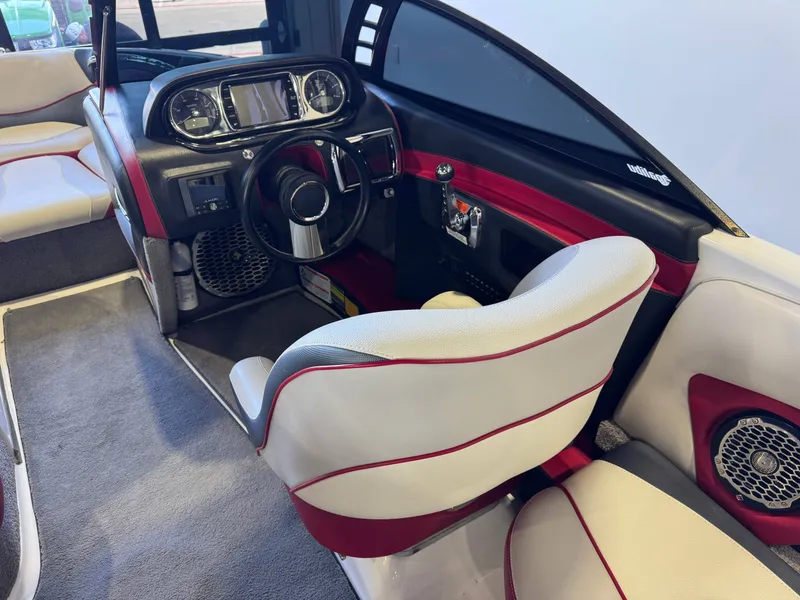Slide: The Image of Interior of a 2012 Malibu Wakesetter 23 LSV boat, modern dashboard. - 24