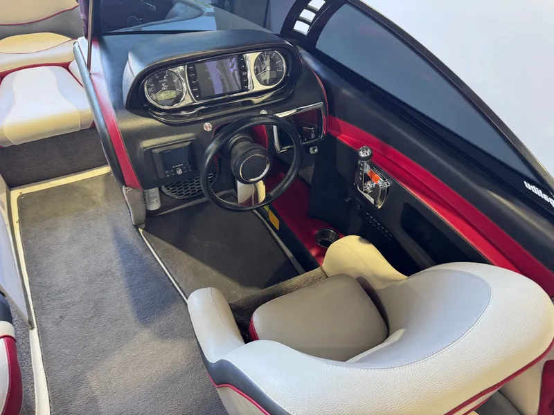 Slide: The Image of Interior of a 2012 Malibu Wakesetter 23 LSV boat with modern dashboard. - 25