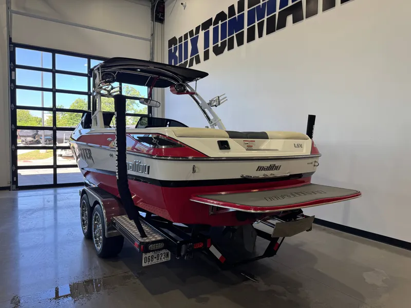 Slide: The Image of 2012 Malibu Wakesetter 23 LSV boat in a garage. - 5