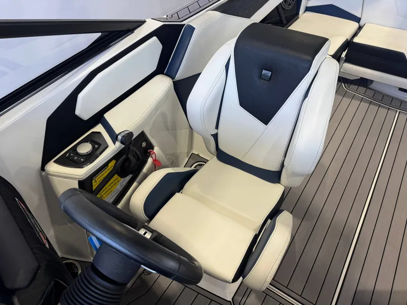 Slide: The Image of Interior of 2023 Nautique Super Air Nautique S23 with steering console. - 27