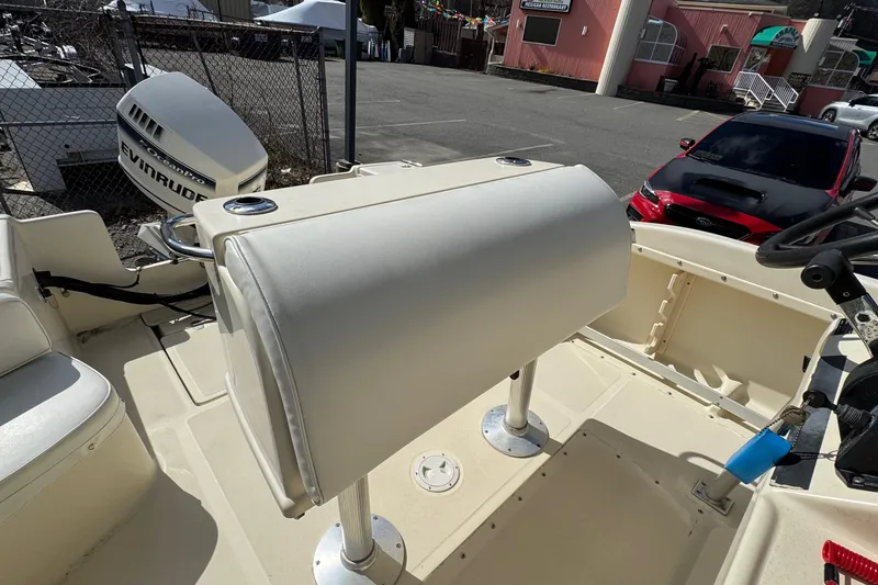 Slide: The Image of 1996 Scout 202 Dorado boat interior with seating and steering wheel. - 11