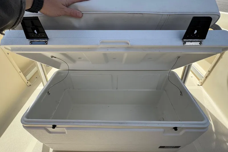 Slide: The Image of Open storage compartment on a 1996 Scout 202 Dorado boat, showcasing interior space. - 17