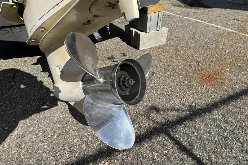 Slide: The Image of Propeller of a 1996 Scout 202 Dorado boat on a concrete surface. - 20
