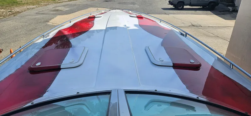 Slide: The Image of 2004 Formula 382 FASTech boat with red and white design. - 14