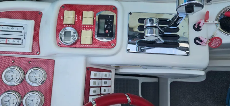 Slide: The Image of Dashboard of a 2004 Formula 382 FASTech boat with red accents. - 16