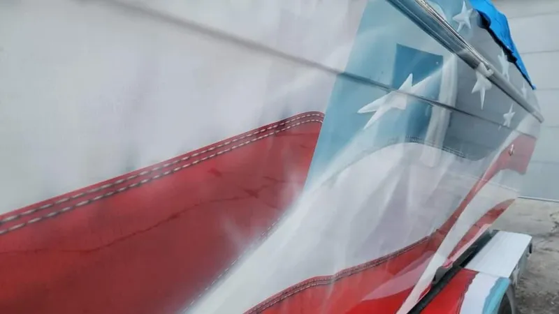 Slide: The Image of 2004 Formula 382 FASTech boat with American flag design. - 22