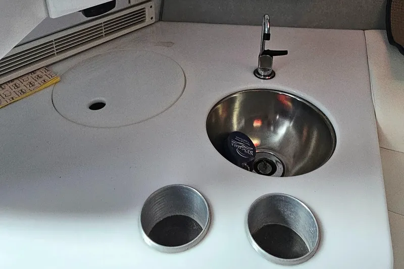 Slide: The Image of Interior of 2004 Formula 382 FASTech with sink and cup holders. - 27