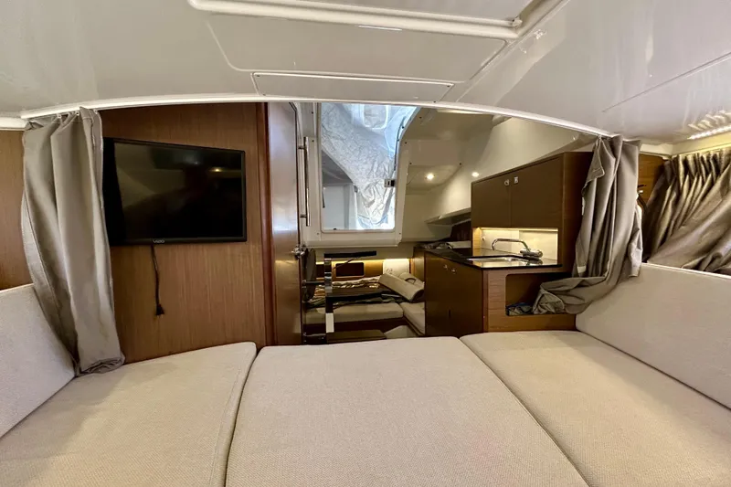 Slide: The Image of Interior of 2019 Jeanneau Leader 9.0 WA boat with cozy seating and kitchenette. - 22