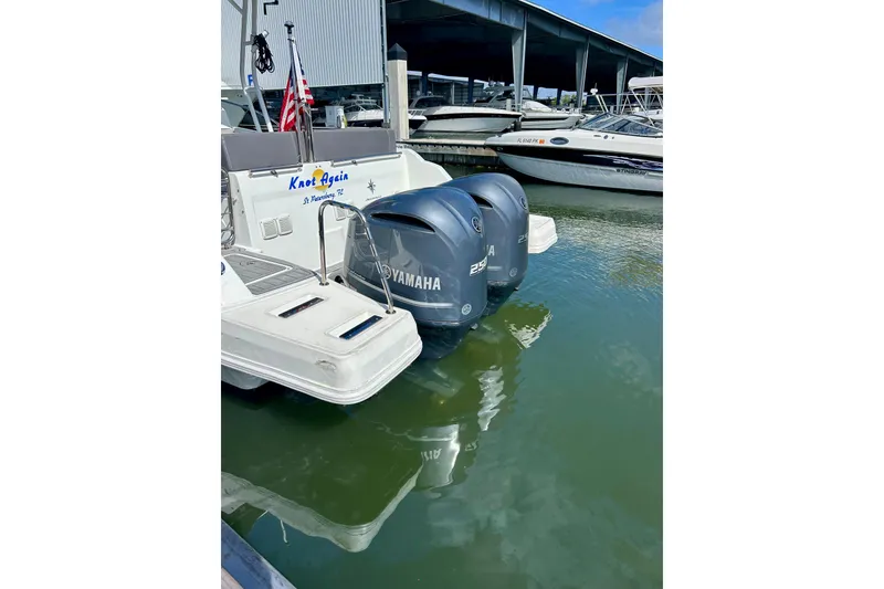 Slide: The Image of 2019 Jeanneau Leader 9.0 WA with Yamaha engines docked at marina. - 6