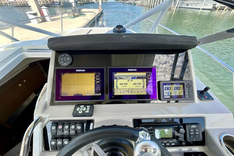 Slide: The Image of Cockpit view of 2019 Jeanneau Leader 9.0 WA with Simrad navigation displays. - 9