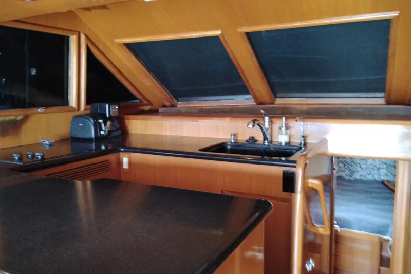 Slide: The Image of Luxurious kitchen interior of 2004 Ocean Alexander 42 Altus yacht with sleek countertops. - 10