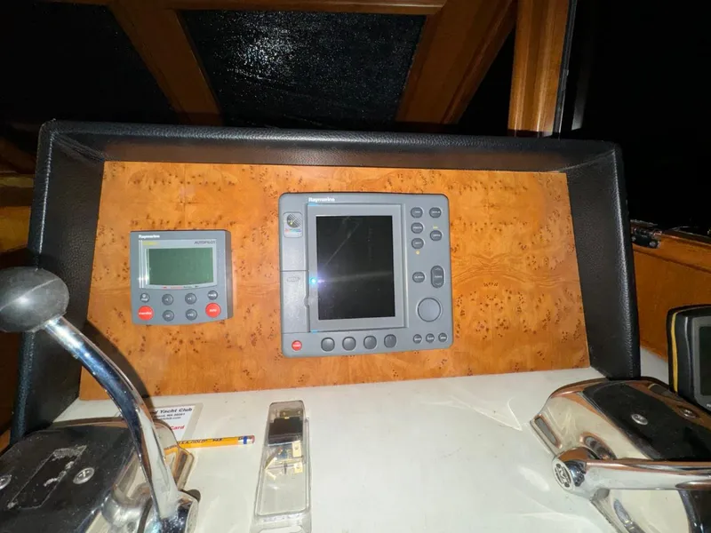 Slide: The Image of Control panel of a 2004 Ocean Alexander 42 yacht with navigation instruments. - 16