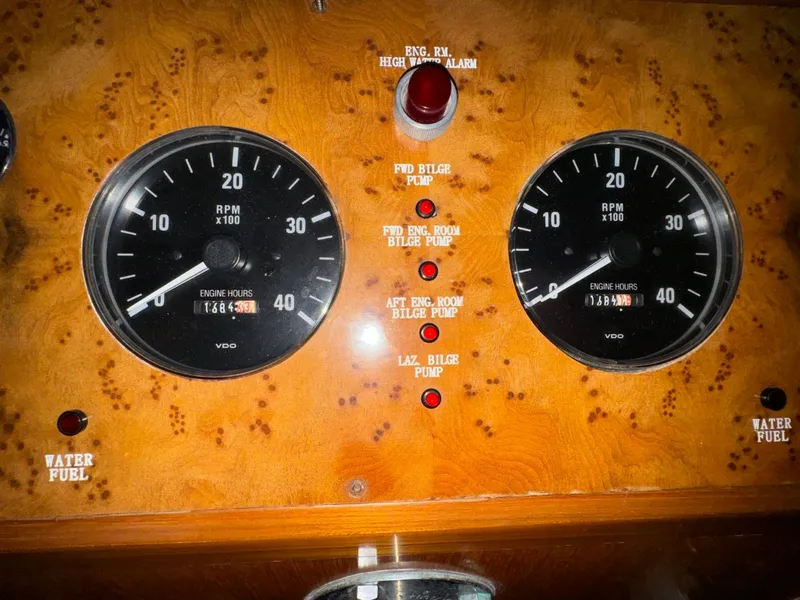Slide: The Image of Control panel of a 2004 Ocean Alexander 42 yacht with RPM gauges and indicators. - 18