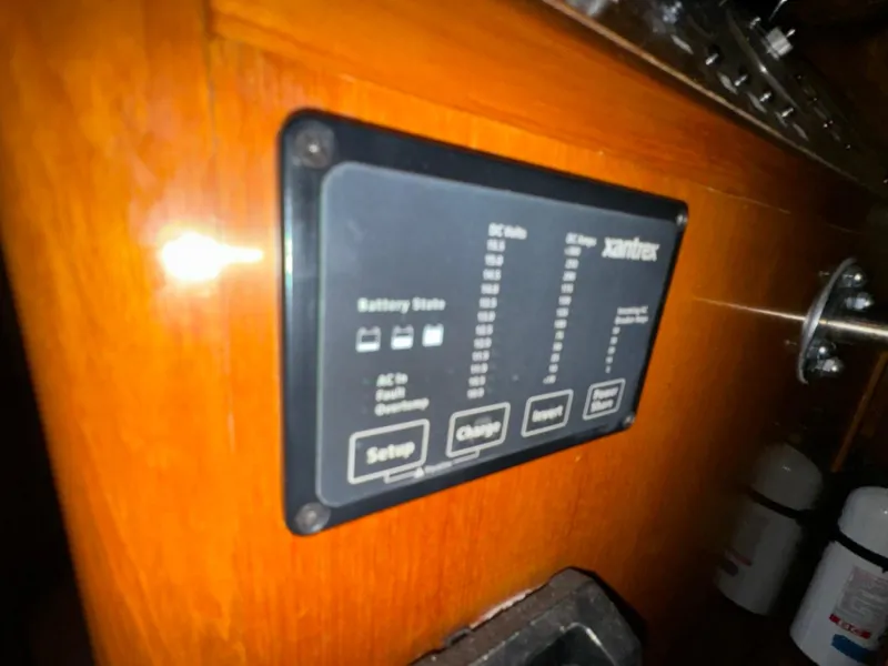 Slide: The Image of Control panel on 2004 Ocean Alexander 42 yacht, displaying battery status and settings. - 19